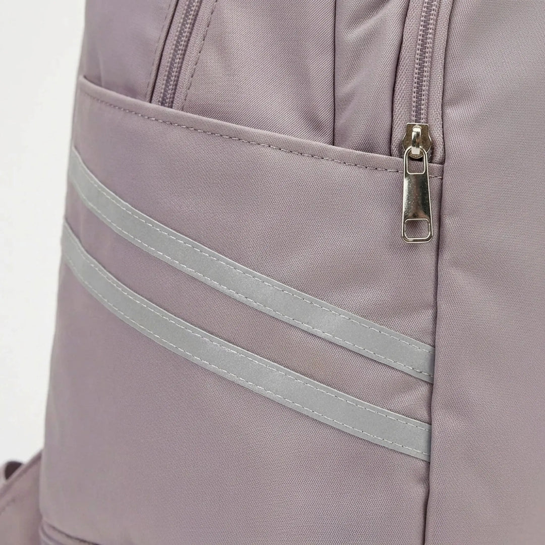 Person wearing versatile multi-pocket sports backpack for gym, fitness, or daily commute. Unisex design.