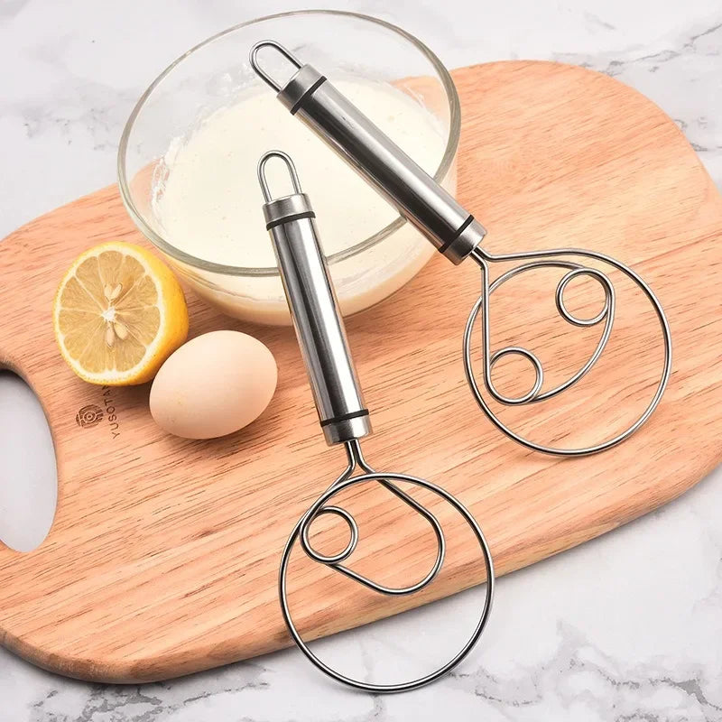 Durable stainless steel kitchen whisk with comfortable grip for efficient baking & cooking.