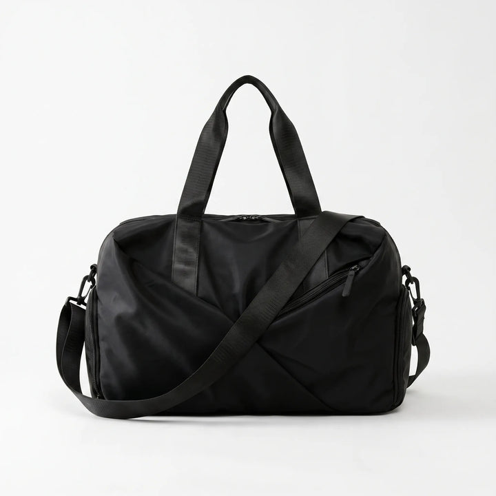 Close-up of the separate ventilated shoe compartment on a multi-purpose gym and travel duffel bag. Keeps gear fresh.