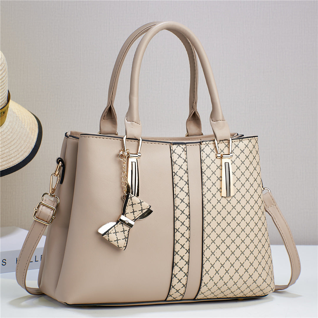 Everyday women's convertible bag, functions as a shoulder or crossbody. Practical, durable fashion accessory.