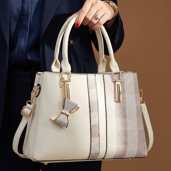Stylish women's convertible handbag, easily switches from shoulder to crossbody. Practical & fashionable.