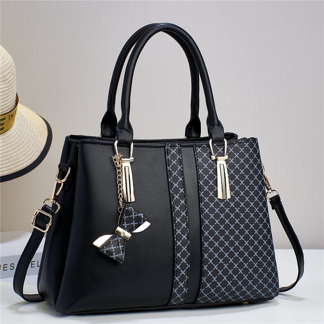 Women's convertible shoulder bag and crossbody bag. Durable and versatile everyday handbag accessory.