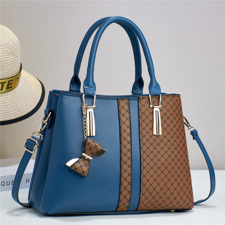 Fashionable women's convertible bag, transforms from shoulder to crossbody. A chic and versatile accessory.