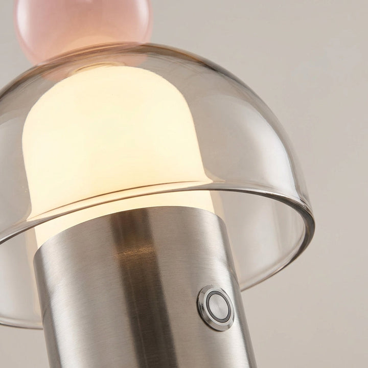 Close-up of Vesanta rechargeable glass lamp on a wooden table, showing elegant design