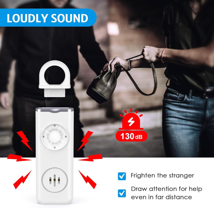 Close-up of Veyora 130dB personal alarm keychain, red with black accents, for emergency alert