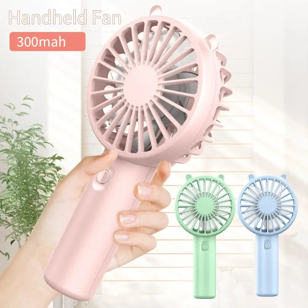 Two Veyra portable USB rechargeable mini fans, one white and one pink, demonstrating the 1+1 FREE offer