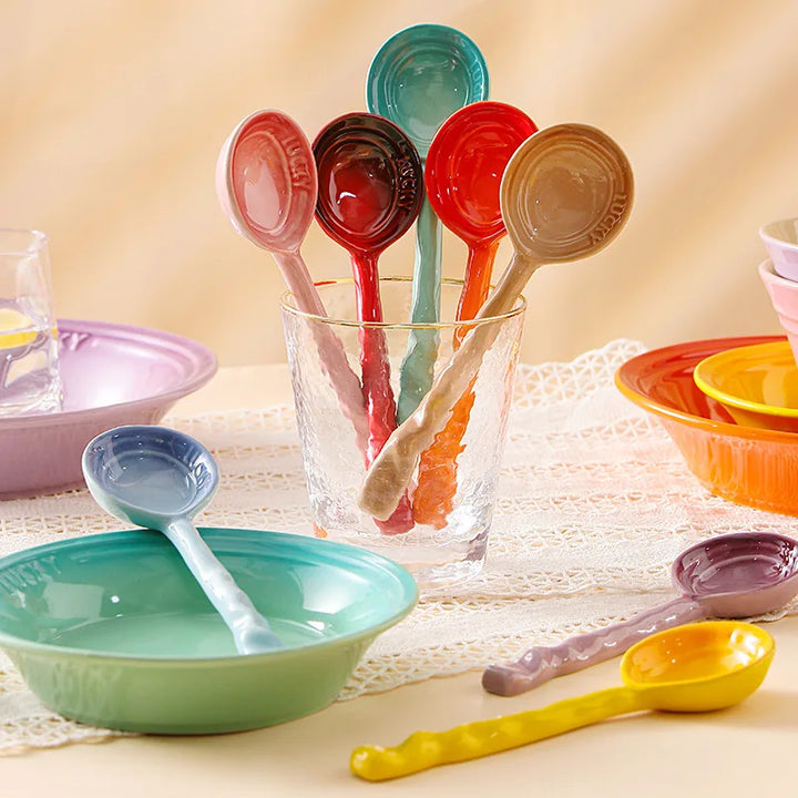 Colorful ceramic kitchen spoons, 8-piece set, perfect for cooking, serving, and home decor.