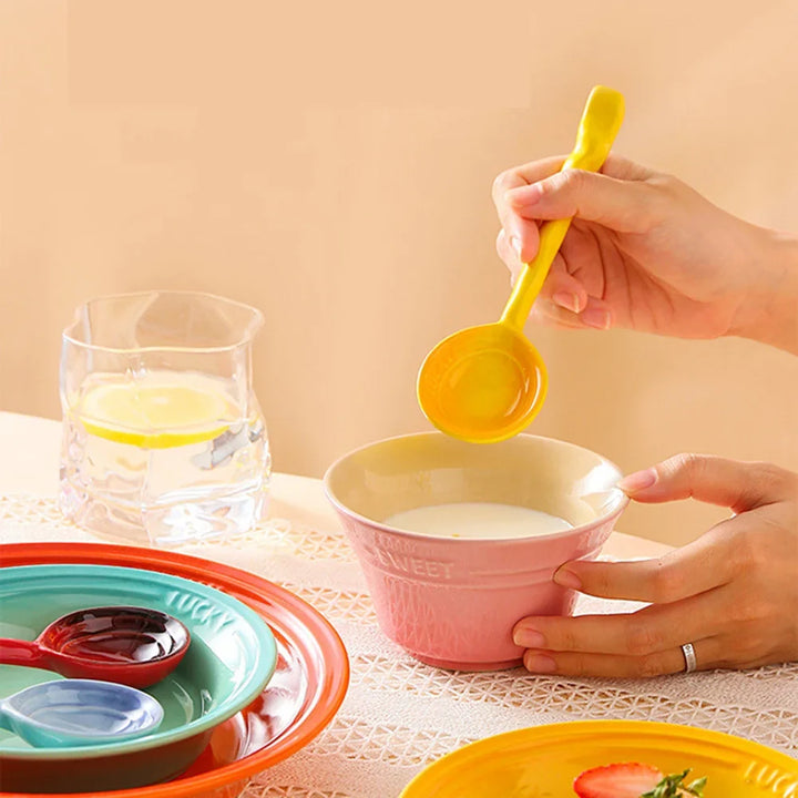 Durable ceramic serving spoons in a vibrant 8-piece set. Stylish wavy handles for kitchen decor.