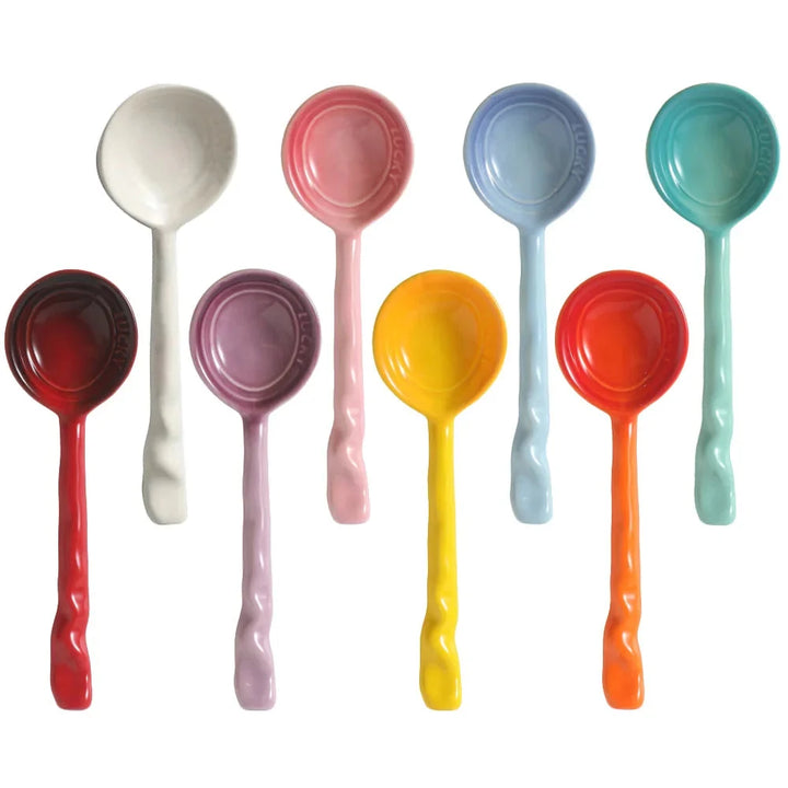 8 vibrant ceramic kitchen utensils: stirring & serving spoons with ergonomic wavy handles.