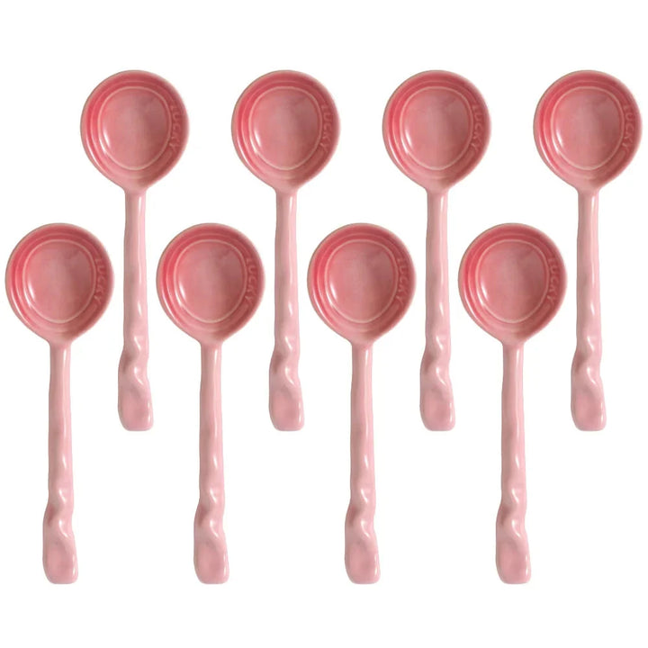 Vibrant ceramic spoon set, 8 pieces, ideal for kitchen tasks & home decor. Wavy handle design.