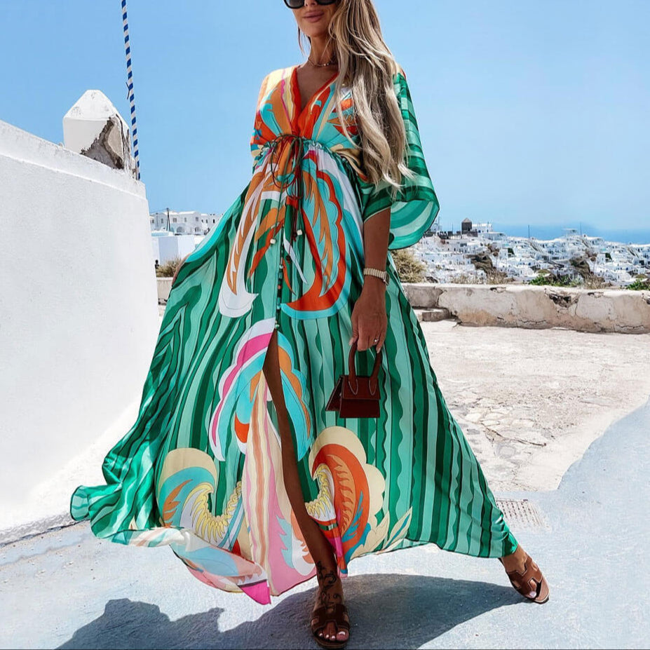 Vibrant abstract print women's maxi vacation dress with a flowy design, perfect for summer getaways.