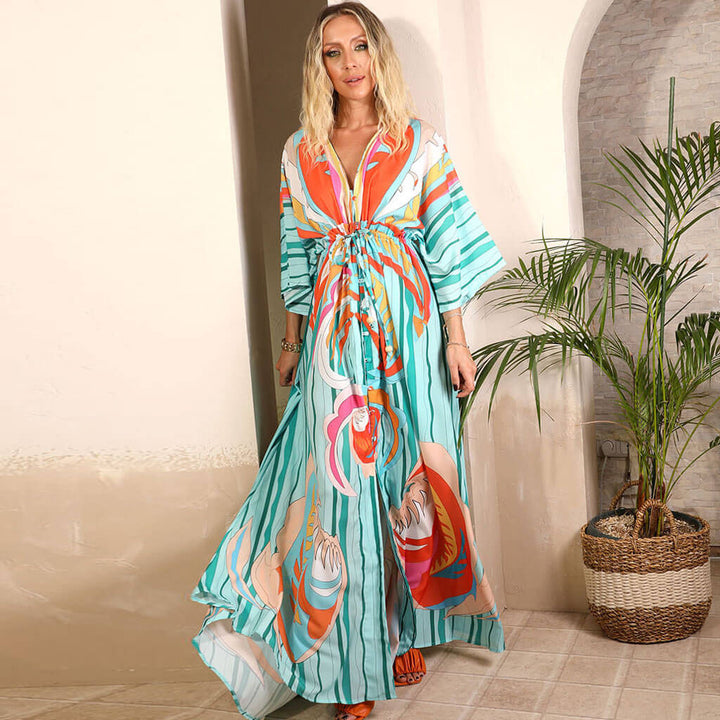 Boho chic green abstract maxi dress for women featuring a v-neck, tie waist, and button front, ideal for summer.