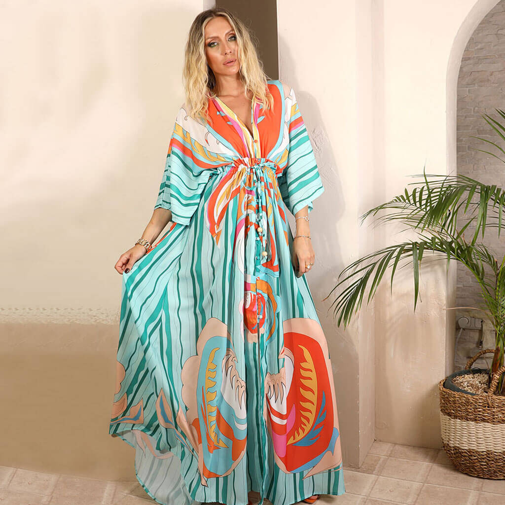 Long, flowy abstract print maxi dress for women. A stylish and comfortable summer vacation dress with a vibrant pattern.