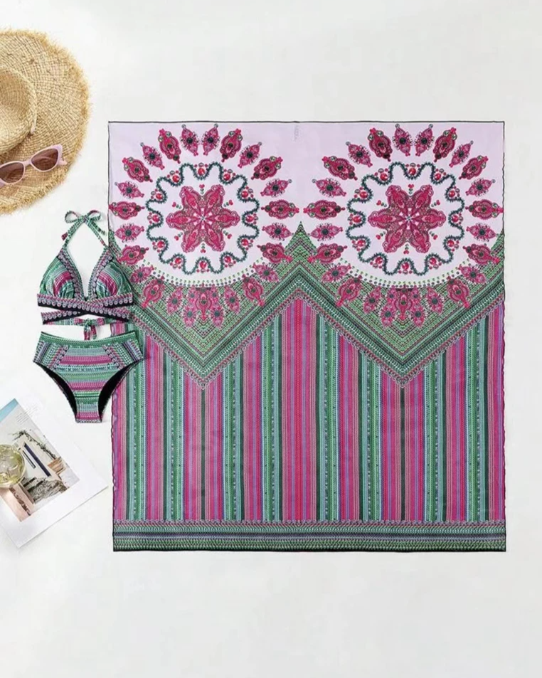 Detail shot of the vibrant ethnic print & soft fabric of women's boho high-waisted bikini & kimono set.