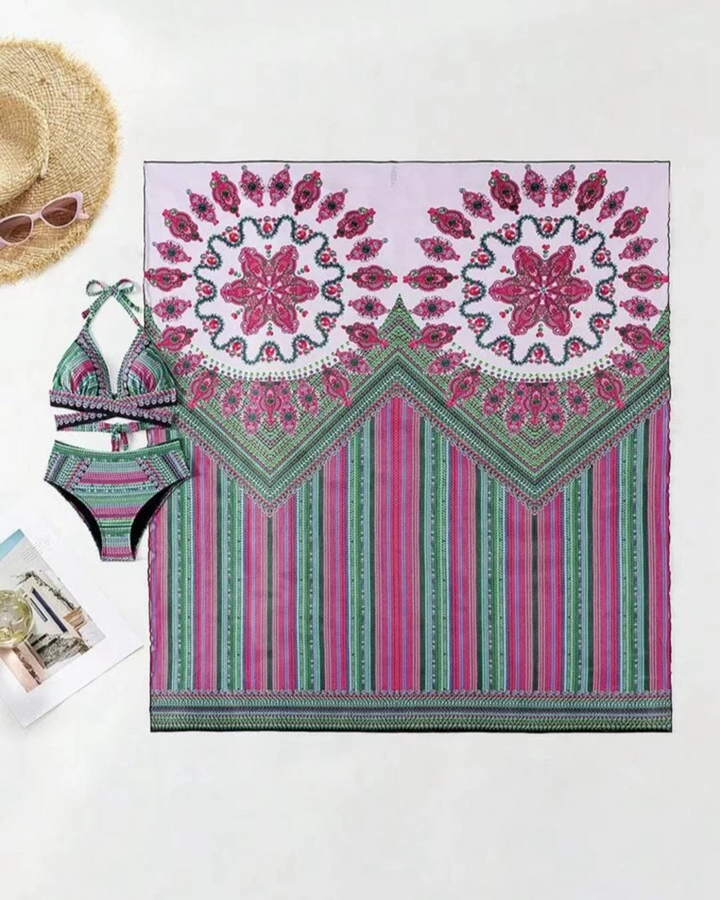 Detail shot of the vibrant ethnic print & soft fabric of women's boho high-waisted bikini & kimono set.