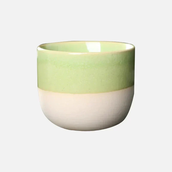 Unique ceramic coffee mug for home, featuring a colorful and modern splatter design.