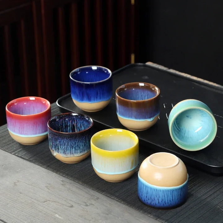 Kitchenware: vibrant ceramic tea cup with an artistic, colorful splatter design.
