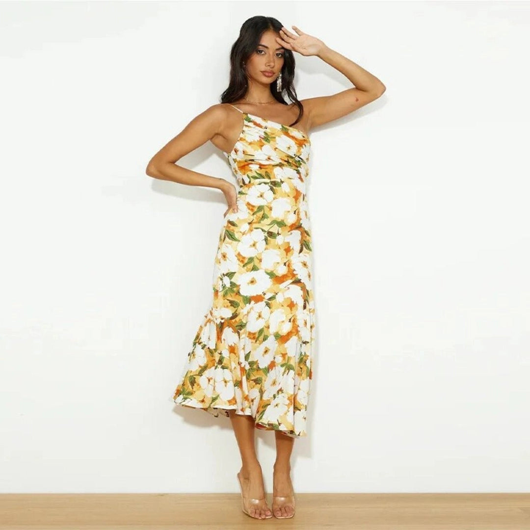 Summer-ready women's floral midi dress, sleeveless, featuring a vibrant print and chic asymmetric flowing hem.
