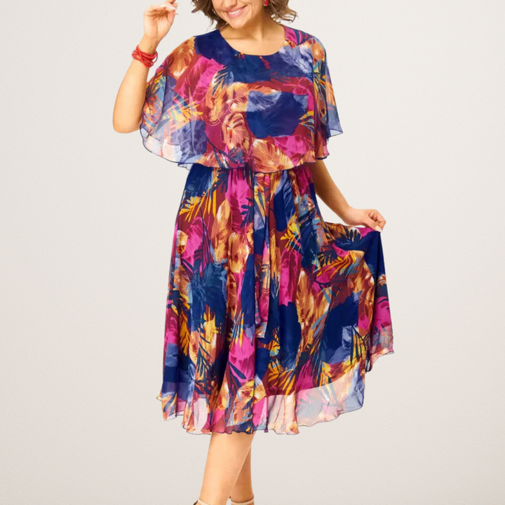 Elegant women's vibrant midi dress with an effortless flowy design, ideal for feminine summer fashion statements.