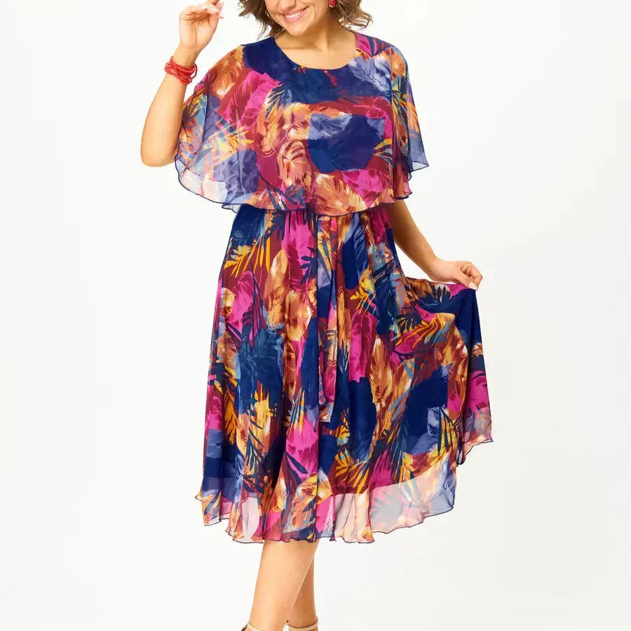 Stylish women's vibrant print midi dress with a flowy silhouette, great for casual chic or occasion wear.