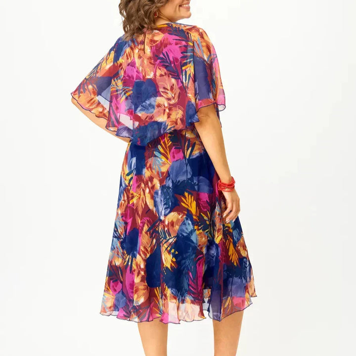 Comfortable women's vibrant print midi dress featuring a flattering flowy silhouette, offering effortless style.