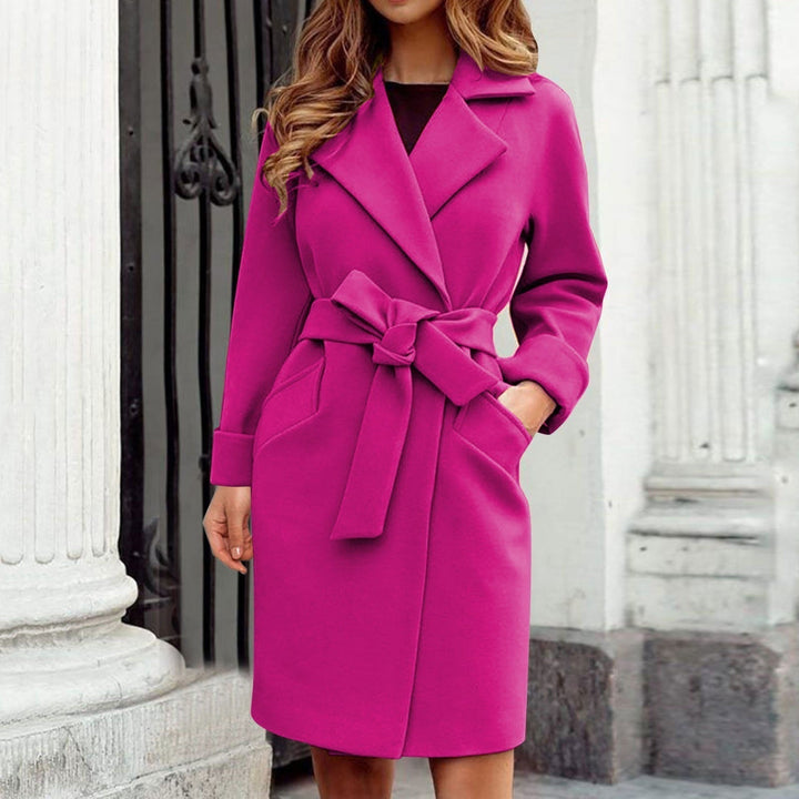 Fashionable women's long winter jacket in a vibrant hue, ideal for staying warm and stylish outdoors.