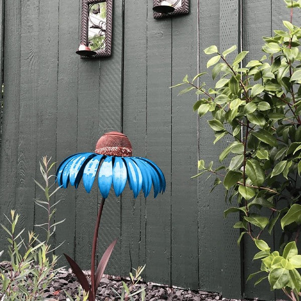 Artistic coneflower-shaped metal bird feeder, a charming garden accessory bringing wild birds closer for observation.