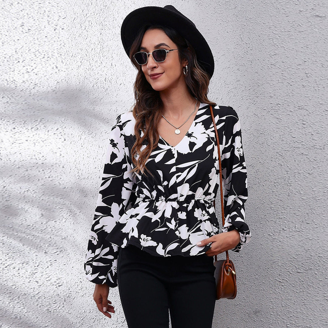 Airy women's blouse with vibrant print. Relaxed fit comfortable top, ideal for summer fashion & daily wear.