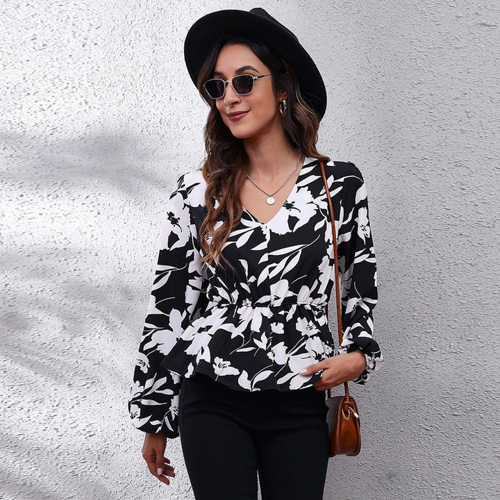 Airy women's blouse with vibrant print. Relaxed fit comfortable top, ideal for summer fashion & daily wear.