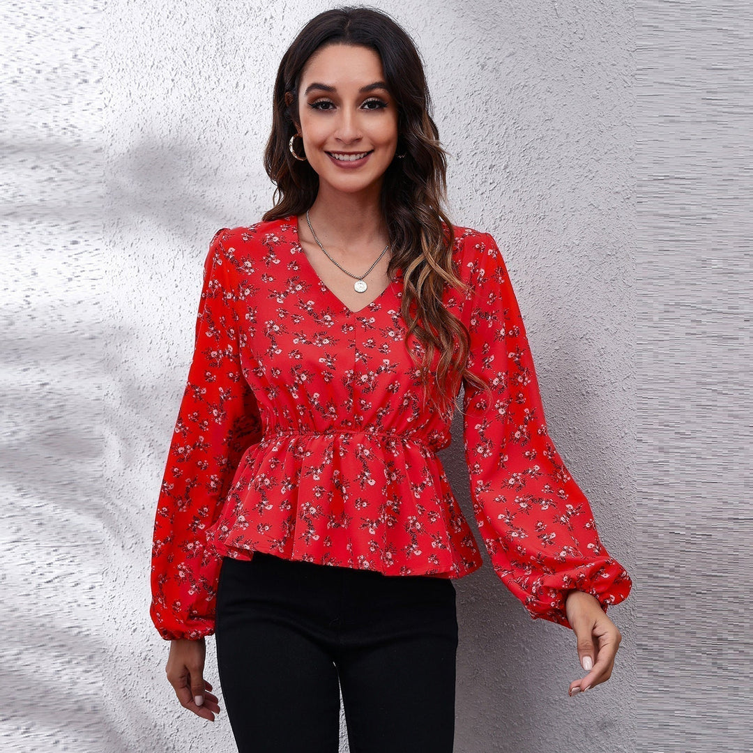 Model wearing a vibrant patterned women's blouse, showcasing its relaxed fit & airy comfort. Perfect for summer.
