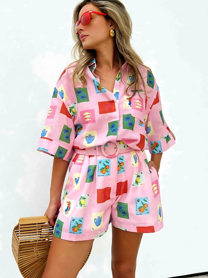 Vibrant pink and yellow floral women's blouse and shorts summer set, perfect for casual fashion