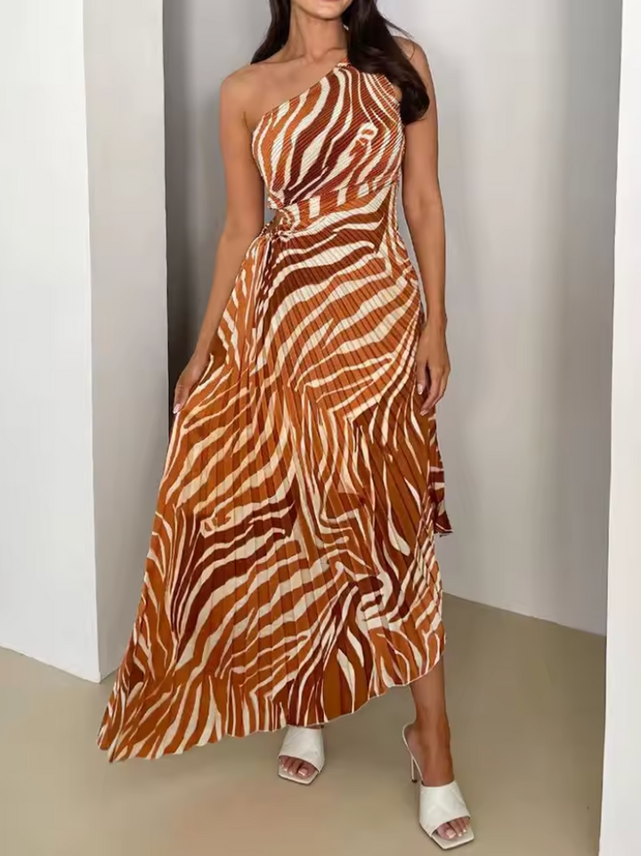 Statement one-shoulder gown for women with vibrant print & asymmetric hem. Perfect wedding guest or evening look.