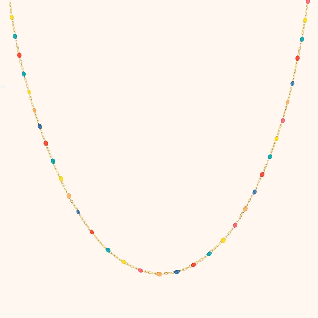 Vibrant rainbow necklace for women, featuring colorful beads & adjustable sterling silver chain.