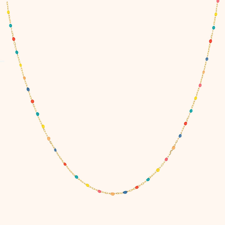 Vibrant rainbow necklace for women, featuring colorful beads & adjustable sterling silver chain.