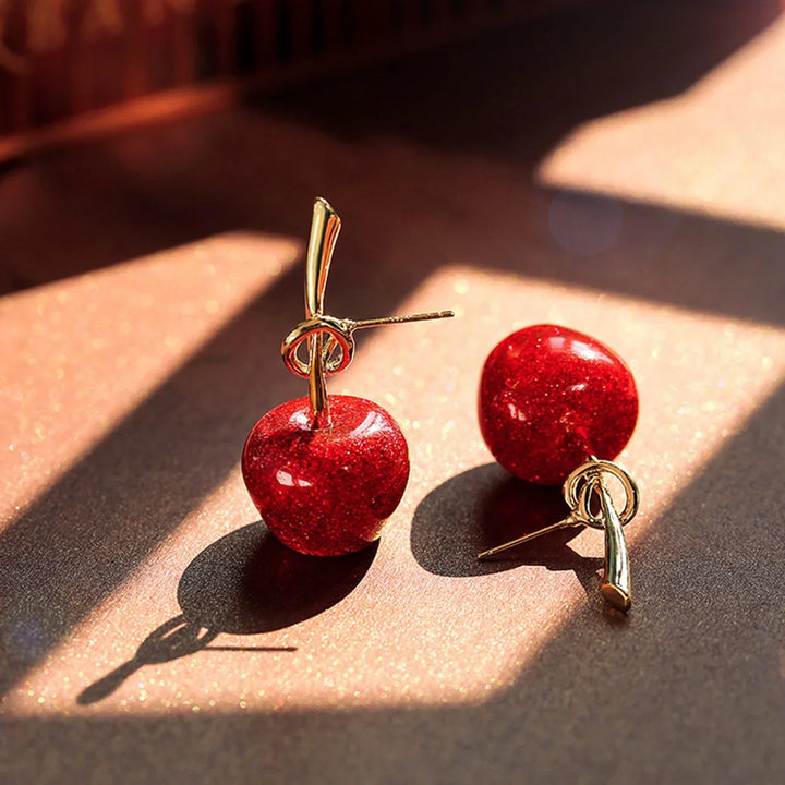 Women's accessory: Striking red cherry dangle earrings, gold-plated for a touch of elegance.