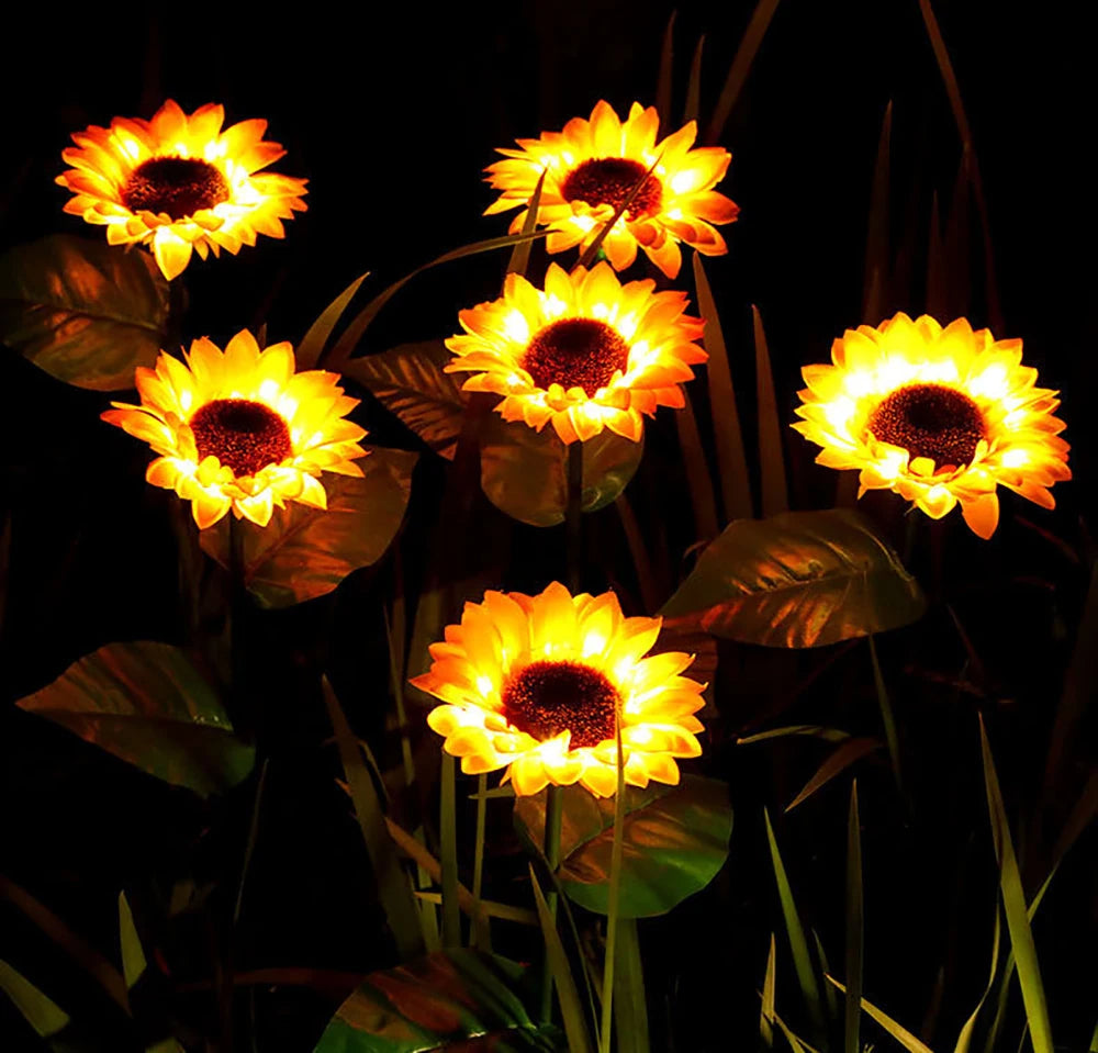 Illuminated solar sunflower garden lamp at dusk, waterproof pathway light, enhancing outdoor decor magically.