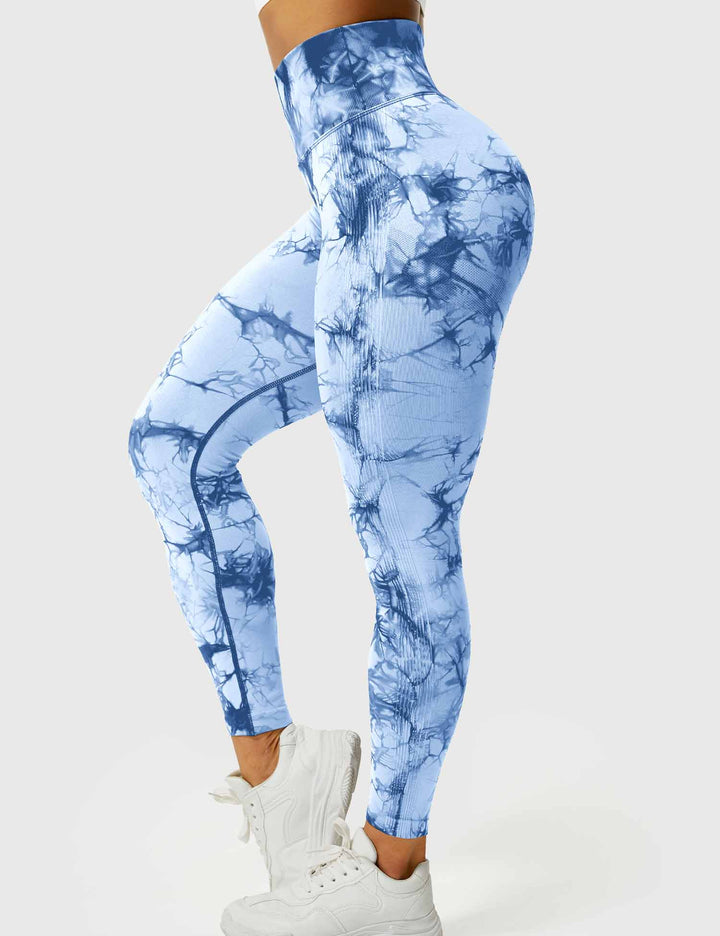 Vibrant tie-dye yoga pants for women, comfortable & perfect for activewear.