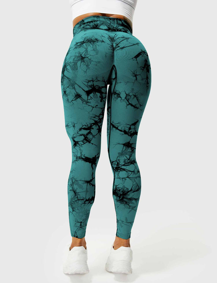 Women's vibrant tie-dye yoga pants, stylish & perfect for athleisure.