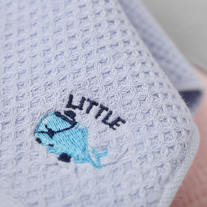 Stack of colorful kids' soft cotton hand towels, a playful and practical bath accessory for children.