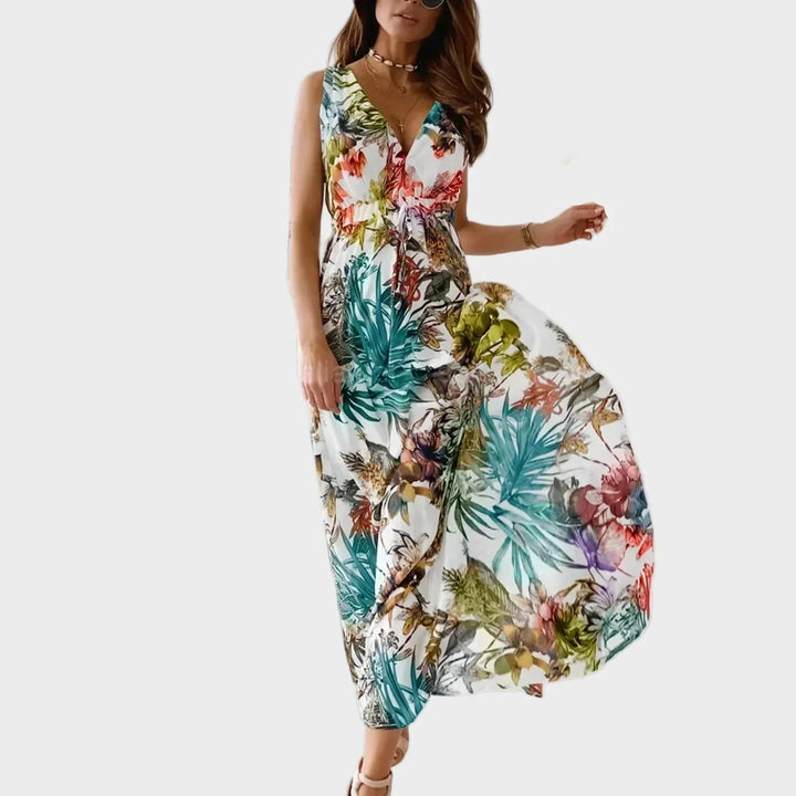 Vibrant tropical floral maxi dress for women, perfect for summer beach vacations. Flowing, sleeveless design with V-neck.