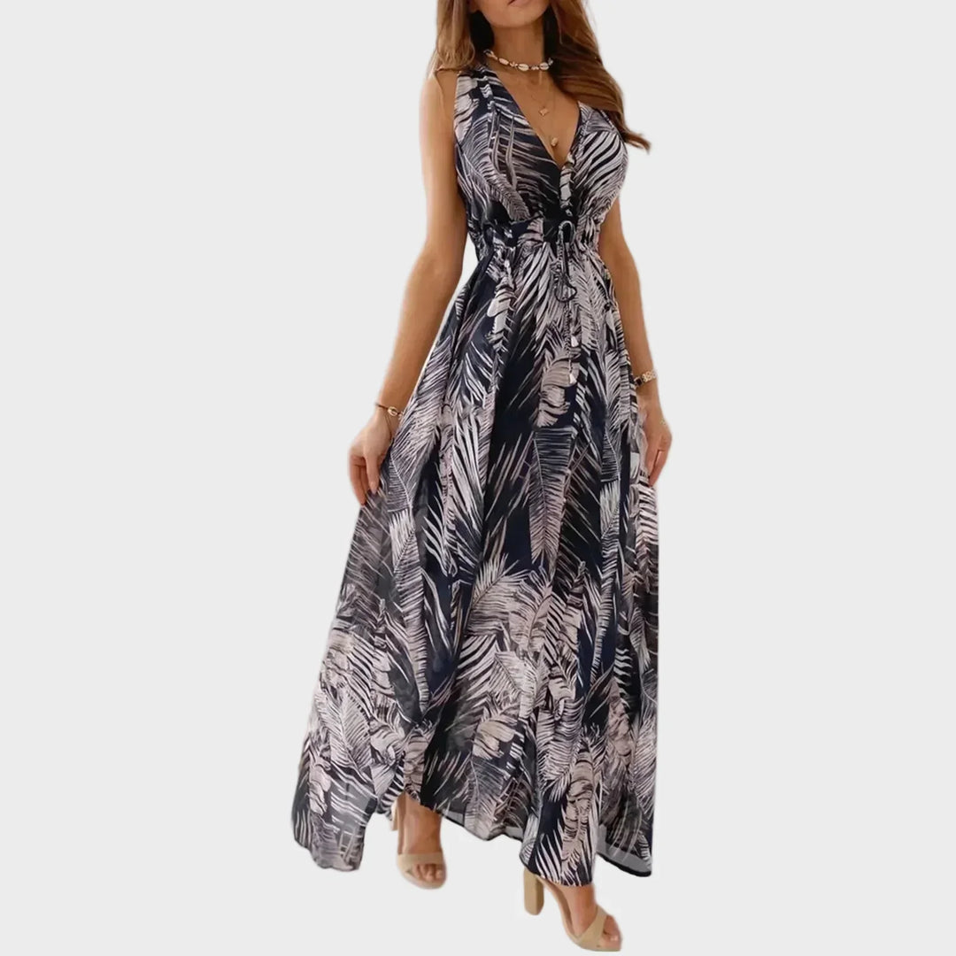 Flowing women's tropical floral maxi dress, a vibrant sleeveless summer style for ultimate comfort and elegance on vacation.