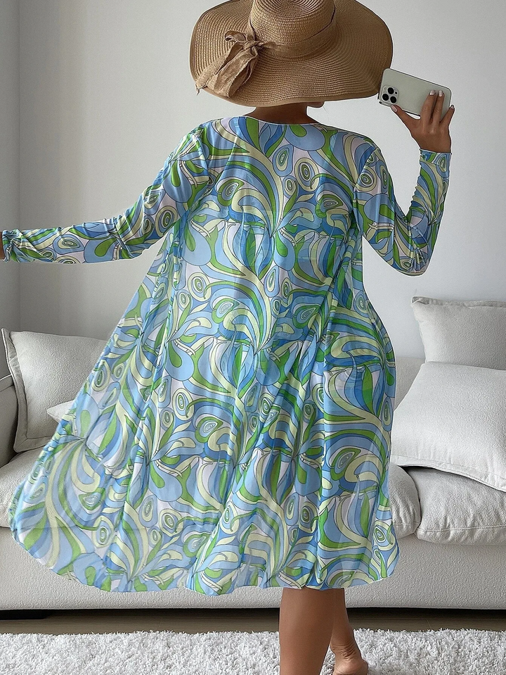Woman modeling vibrant 3-piece swim set & mesh cover-up, perfect for a tropical vacation. Resort style.