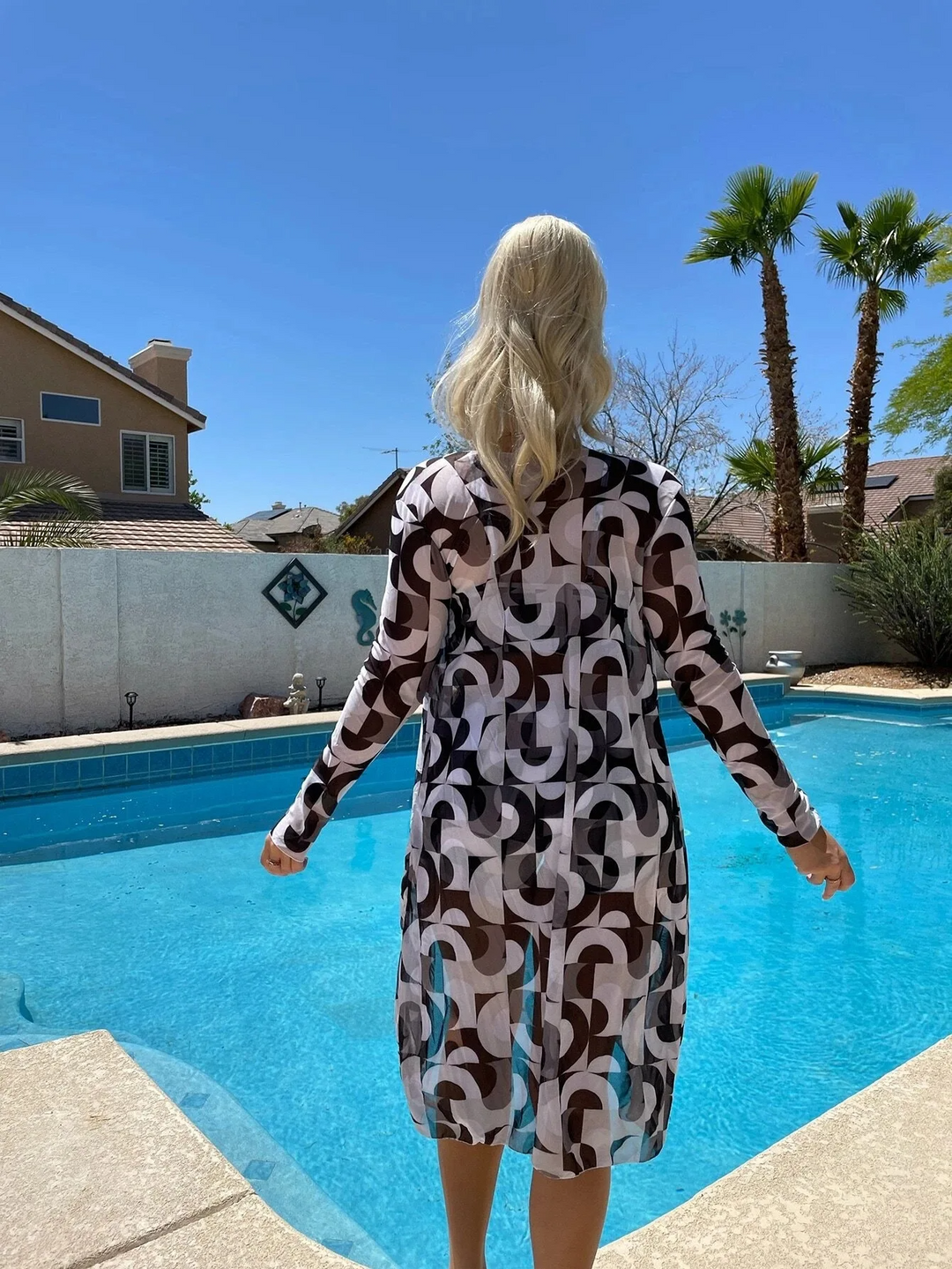 Front view of vibrant women's Cabana 3-piece swim set with cover-up, stylish for resort wear & beach.