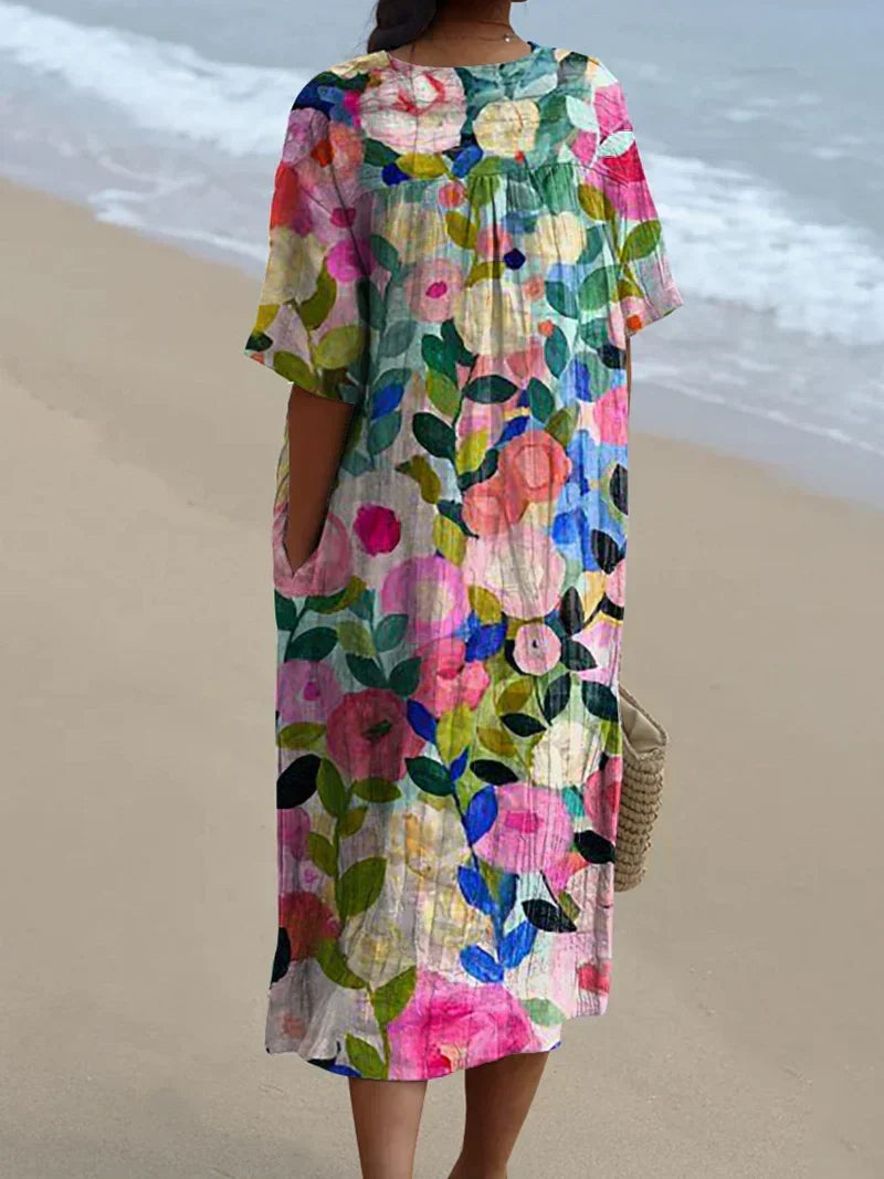 Women's Flowy Dress featuring a bright Floral Garden Print. Ideal for spring fashion or a casual summer day.