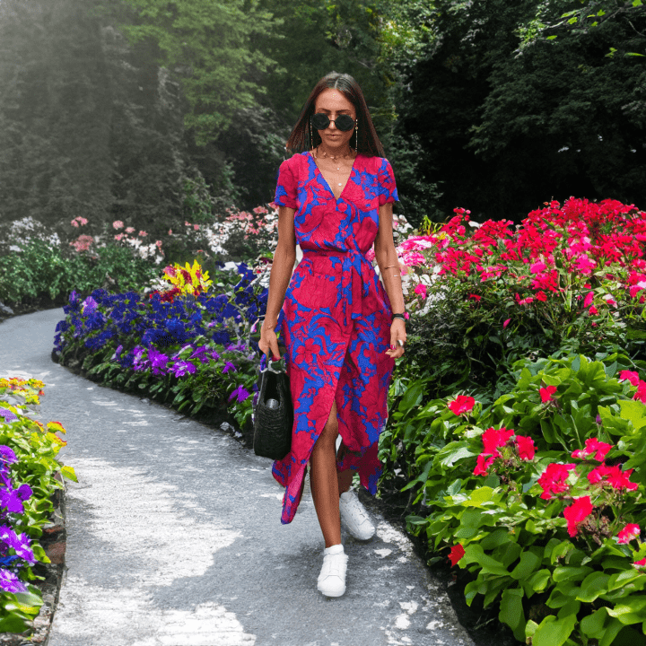 Vibrant women's V-neck summer dress. Colorful, flowy, and comfortable for warm weather casual style.