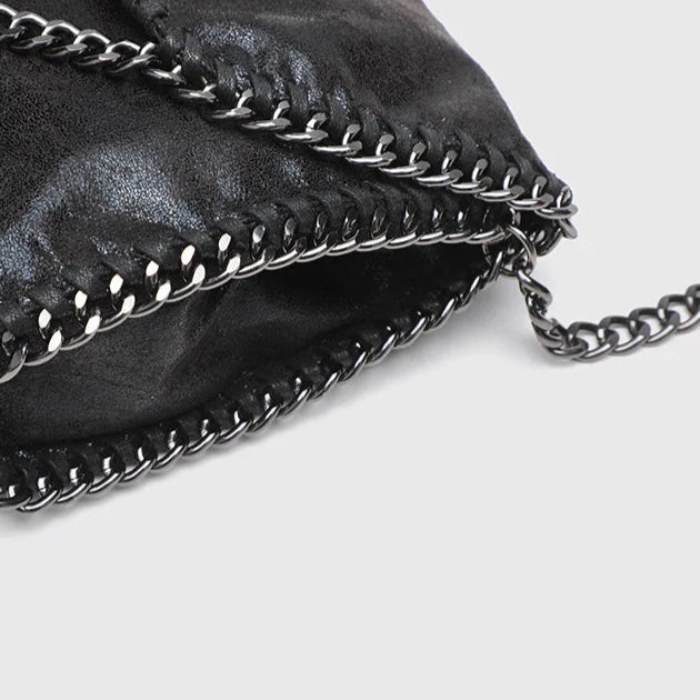 Chic women's vintage black shoulder bag, the Jett handbag adds a gothic touch to any everyday outfit.