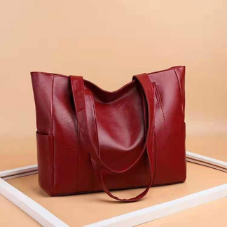 Stylish red vintage tote bag for women. Elegant design, versatile everyday shoulder bag & fashion accessory.