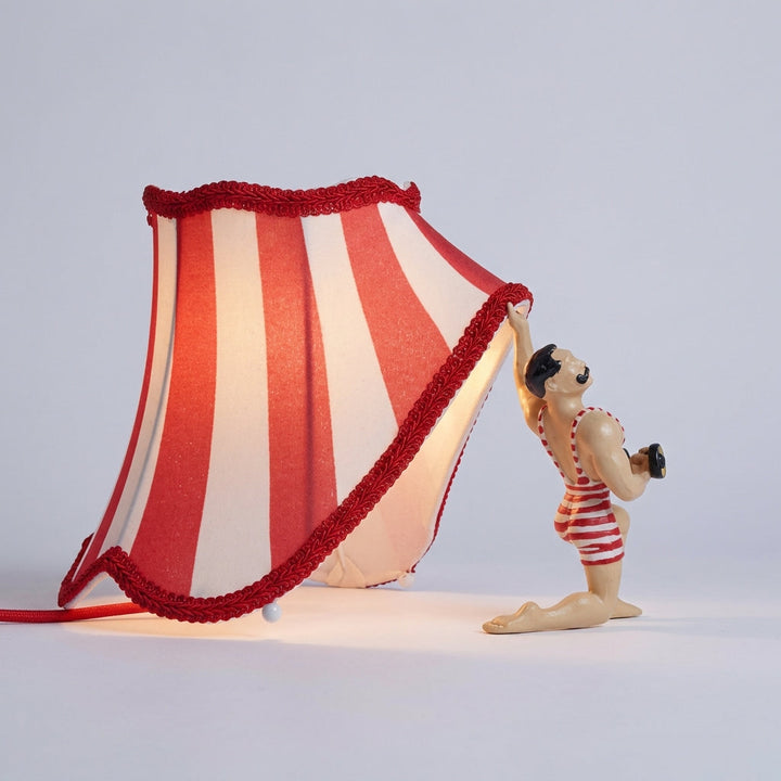 Unique Strongman accent lamp, vintage circus style, decorative novelty table light.
