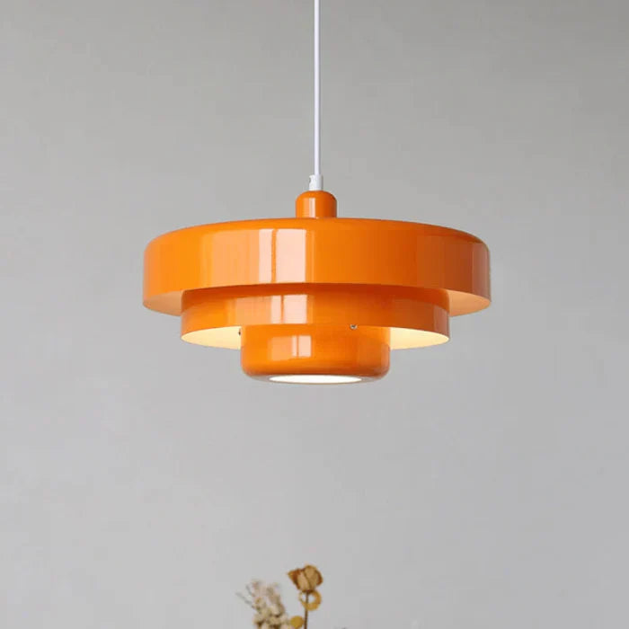 Retro industrial LED pendant lamp hanging in a modern vintage dining room setting