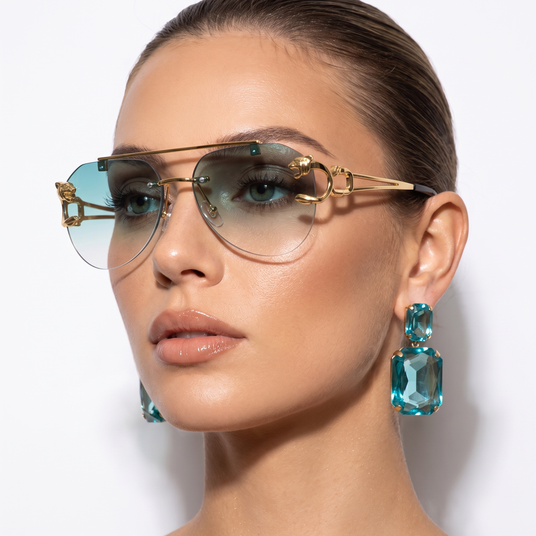 Elegant women's vintage-inspired semi-rimless sunglasses. Tinted lenses offer stylish UV eye protection.